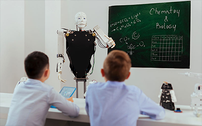 Children observing a robot to hightlight educational use.