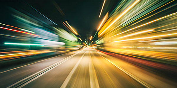 Time-lapse light trail on a road to hightlight speed