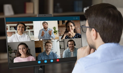 Excited employee staring into video call with others