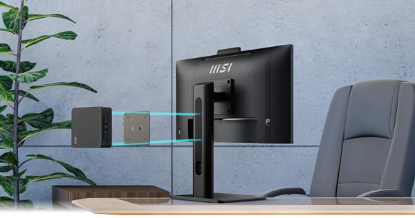 Exploded view of NUC and VESA mount installed to back of monitor on natural desk