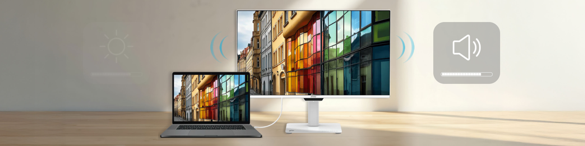 MSI monitor and laptop on a wooden desk.