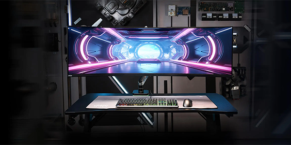 Ultra wide curved monitor mounted on monitor arm.