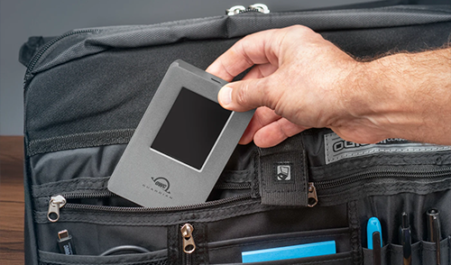 Guardian being tucked into black bag pocket