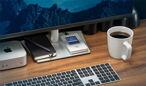 Office space with guardian placed on monitor base