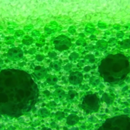 Green foam with medium air bubbles pushed down