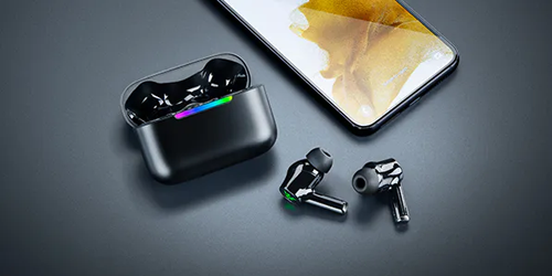 earphones and case sat next to phone