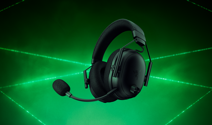 Razer Blackshark V3 Pro Black Wireless Gaming Headset hovering over green laser field and smoke