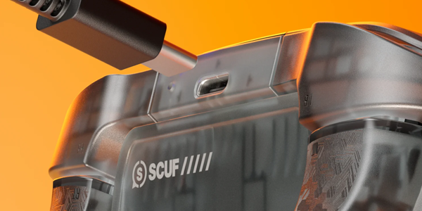 USB-C cable positioned out of the charging port on the center rear edge of the controller between the bumpers.
