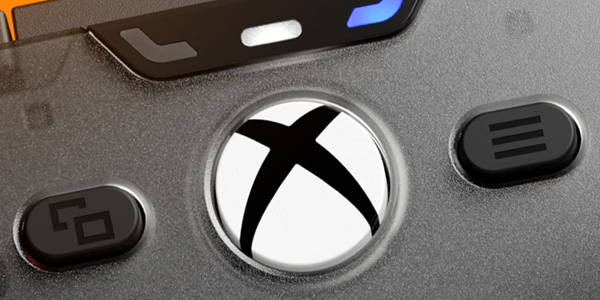 Xbox button at the top on the face of the controller.
