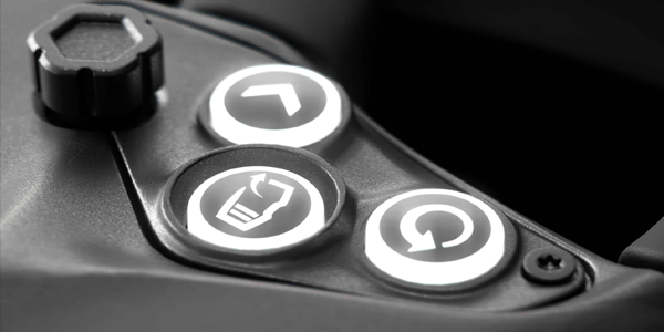 Simucube Savu Pro wheel closeup, highlighting backlit buttons.