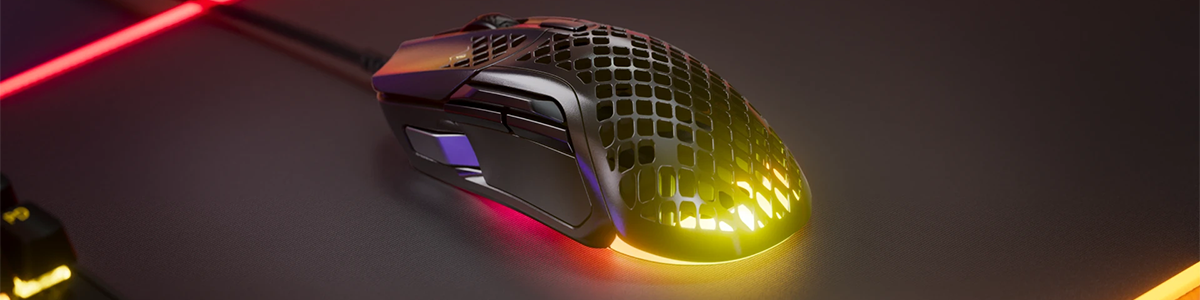 Key visual of the Aerox 5 wired version on an rgb-edged mousemat.