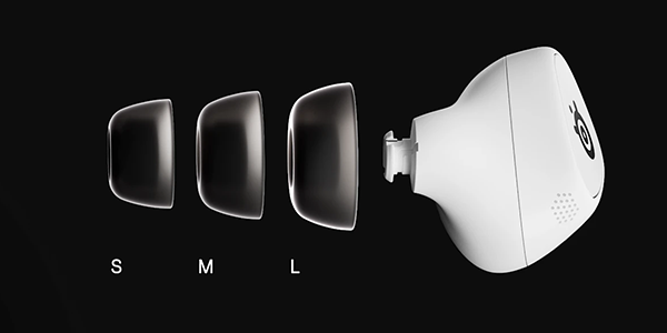 Small, medium and large ear tips beside the GameBud.
