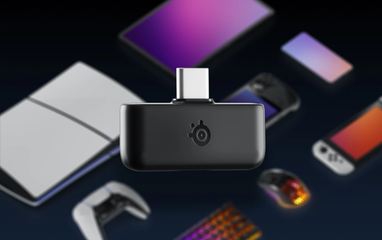 USB C dongle with PS5, switch, ROG ally and PC peripherals organised in the background
