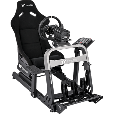 Image cockpit with racing wheel, pedals and a keyboard