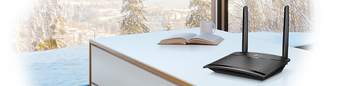 TL-MR100 on office desk with winter scene through wthe background window.