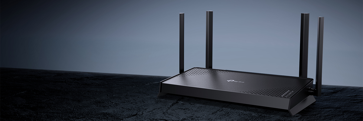 Key visual of Archer BE220 router angled atop a slate table with ambient blue background.