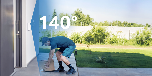 Side angle of delivery man, placing parcel on the doorstep with 140 degree blue overlay beside doorbell lens.