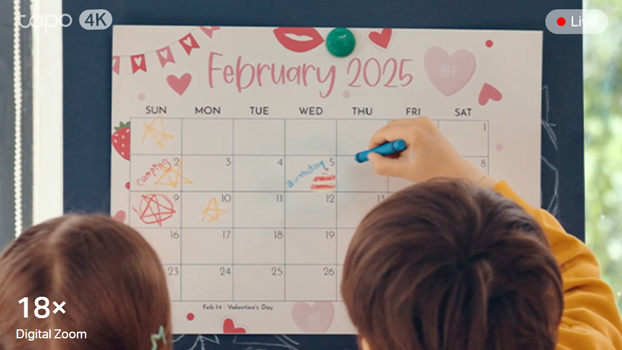 18x zoom of children in school writing on calender.