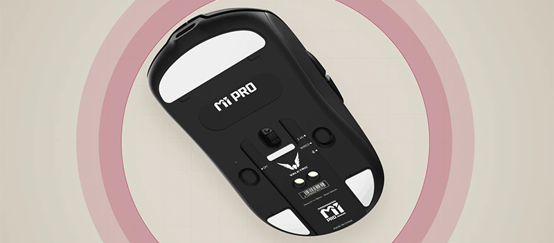 Bottom of black mouse visible with skates, sensors and mode switcher