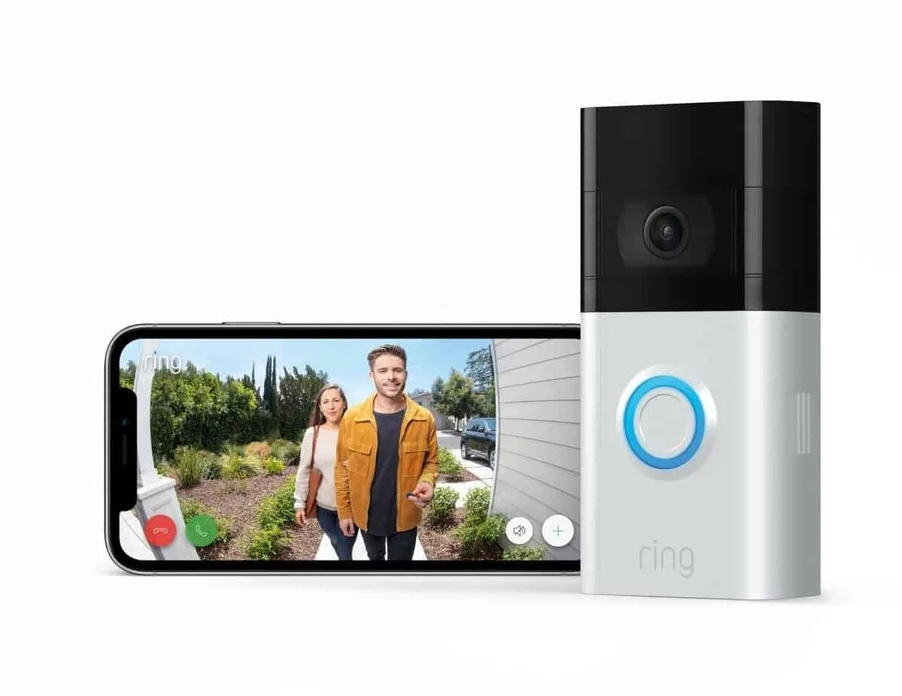 Smart video doorbell installed beside a front door