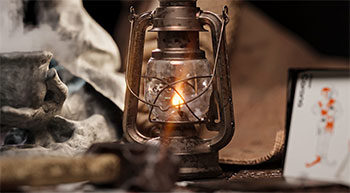 Rendered sample image of oil lantern lit in darkened room