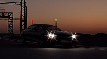 rendered image of Mercedes car at night with flare on headlights