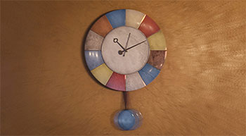 paused render of clock on clay wall