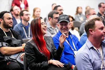 SOLIDWORKS Community members laughing at a seminar