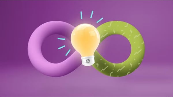 a glowing light bulb positioned between a purple ring and a green patterned ring