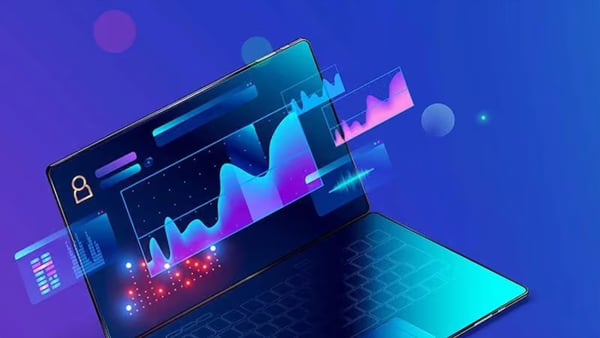 a digital graphic of a laptop with colorful charts and data analytics floating on the screen