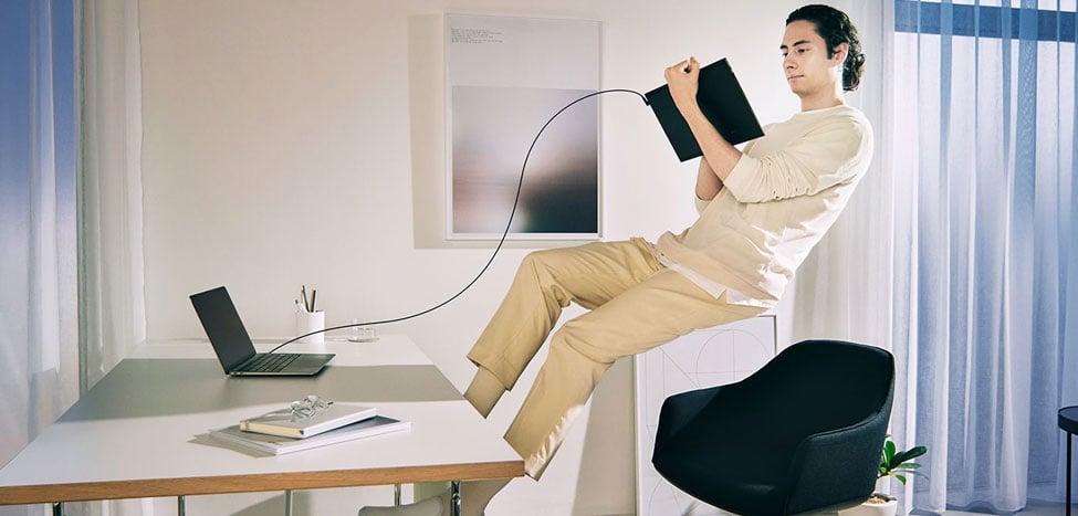 someone floating in the air using the wacom drawing tablet