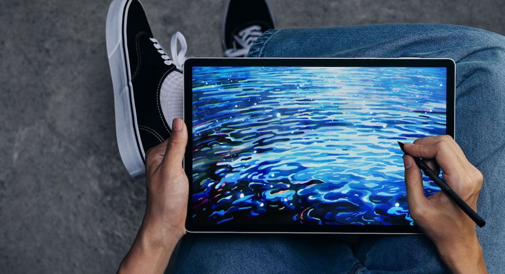 someone sketching using the wacom tablet