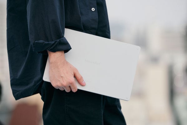 someone carrying the wacom tablet underarm