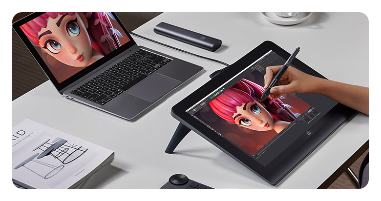 someone using the xp pen artist 16 2nd gen on a desk