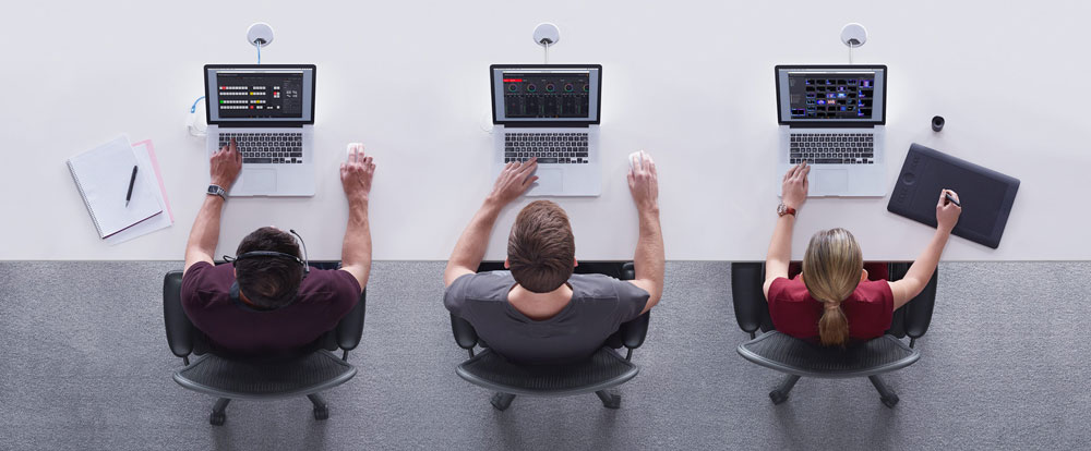 top down view of 3 people working using the atem switcher