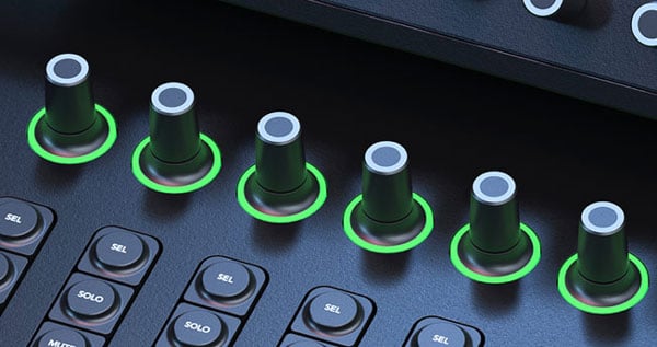 close up of the blackmagic fairlight live audio panel pan knobs