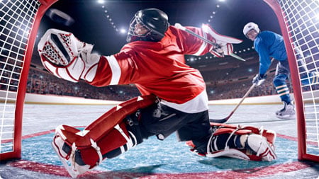 background image of a goal being scored in a hockey match