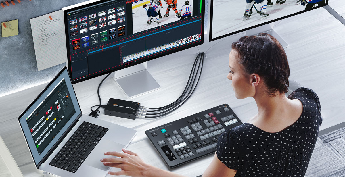 somone working on a laptop at a desk using ultrastudio mini replay 12g and a davinci resolve replay editor