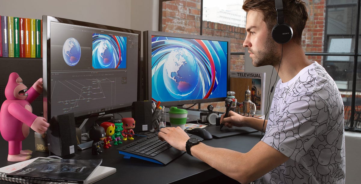 a graphic designer working a desk in a home studio