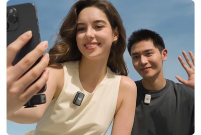 man and woman recording selfie video with iPhone and DJI mic 2 dual microphone system