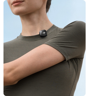 person wearing khaki t-shirt with DJI Mic Mini Clip on mount