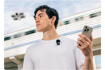 Young male content creator using DJI Mic Mini to capture audio while flying DJI Neo drone