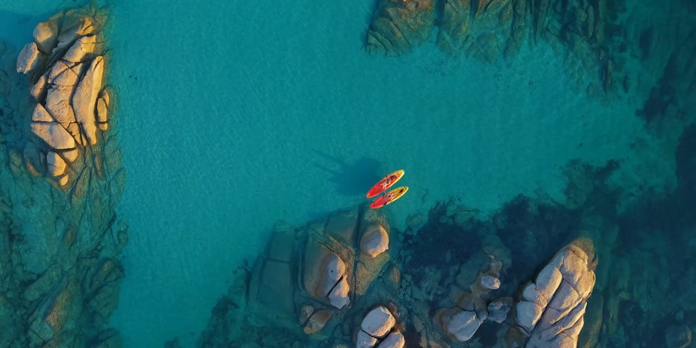 dji mini 5 pro sample top down image of two people in canoes