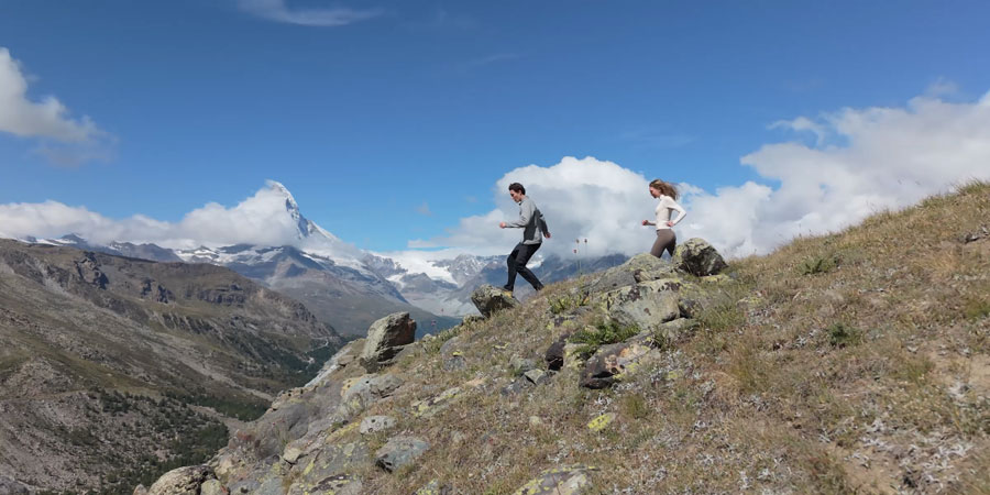 dji mini 5 pro sample image of people running along a mountain