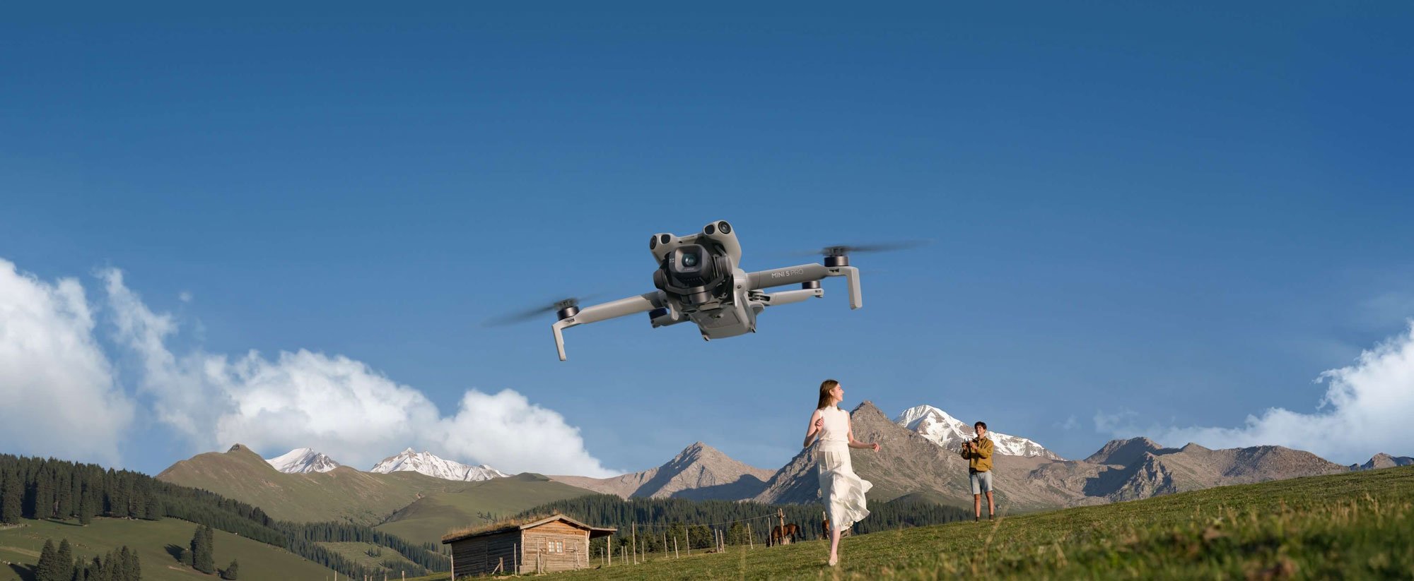 someone controling the dji mini 5 pro in a mountain range