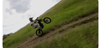 animated gif of person riding electic motorcross bike along dirt road