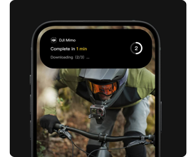 image of iphone with image of mountain bike rider on screen with download notification