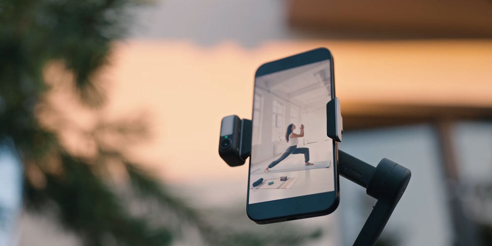 dji osmo mobile being used for live streaming yoga