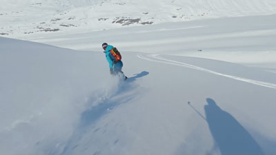 dji osmo nano being used to film a snowboarder