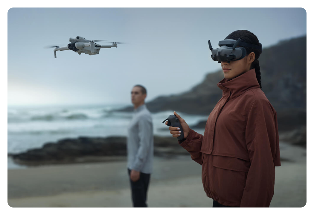 someone flying a drone on a beach using the dji rc motion 3